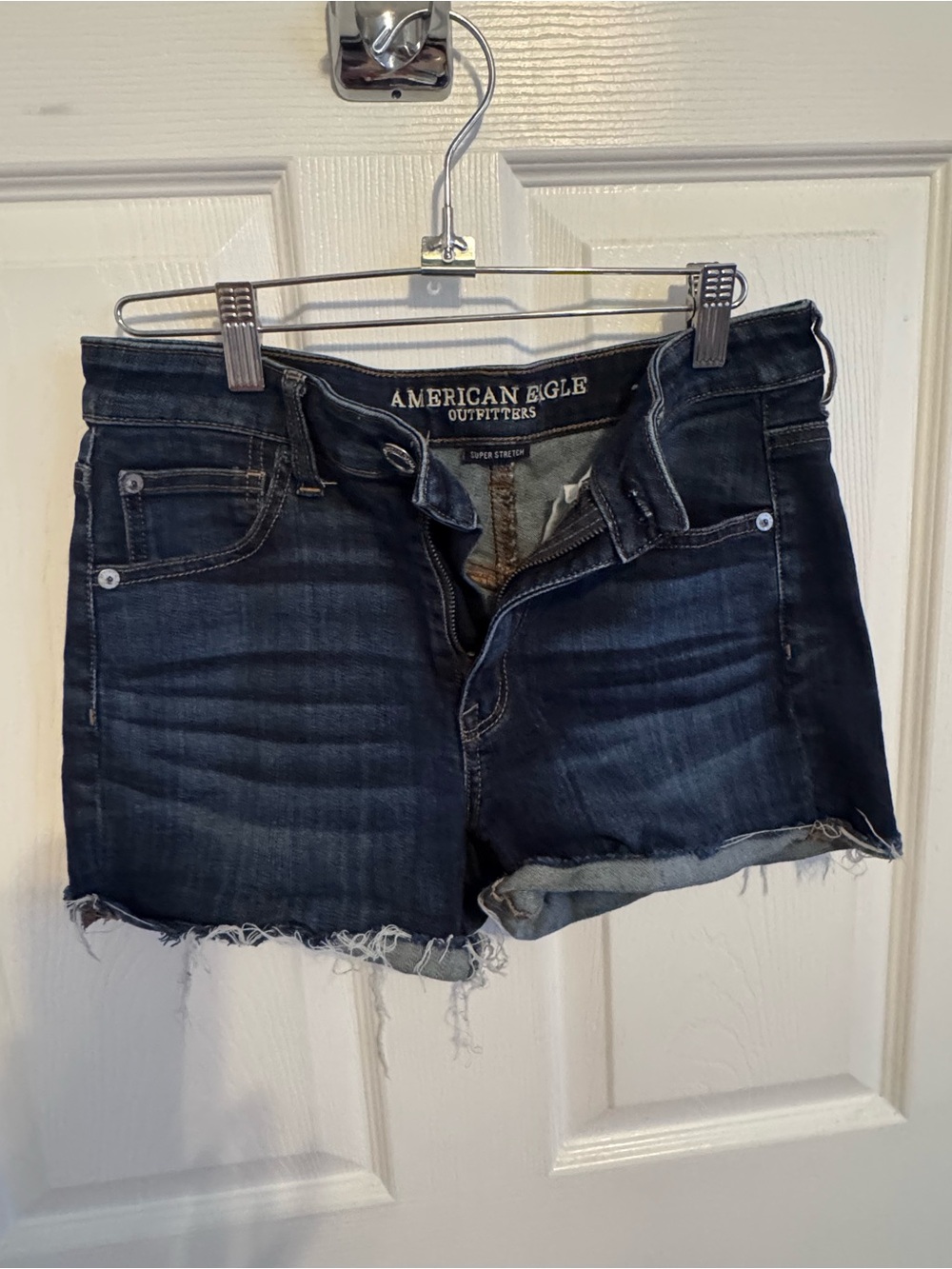 American Eagle Outfitters dark blue denim frayed cutoff shorts